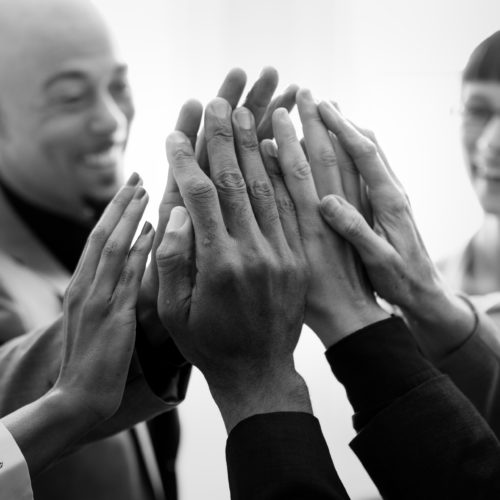 Cheerful business people doing a high five